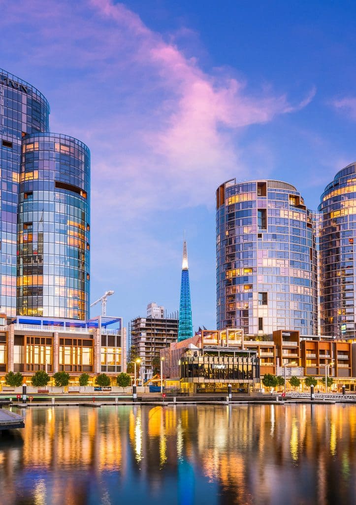 Electrician Perth - Perth city skyline reflecting in the water at dusk.