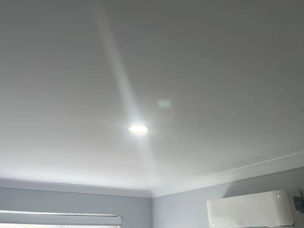New LED downlight installed in a Yokine bedroom ceiling where a faulty ceiling fan was removed by Perth Complete Electrical