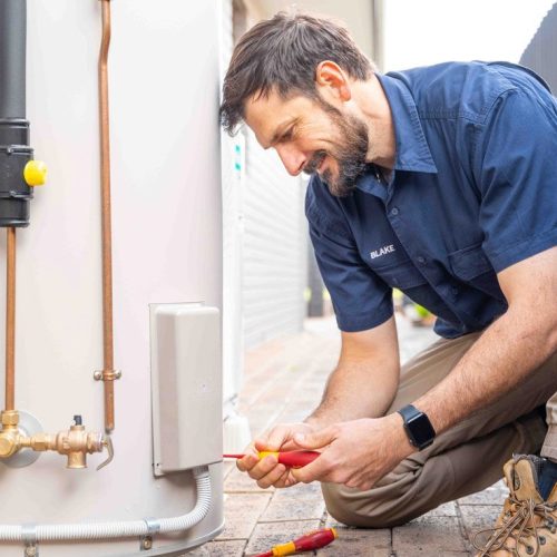 Electrician installing new power outlets in a home renovation project